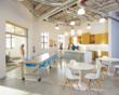 Designed by ADD Inc Miami, BGT's Employee Lounge Area - complete with open kitchen, built-in benches and communal stainless steel table.